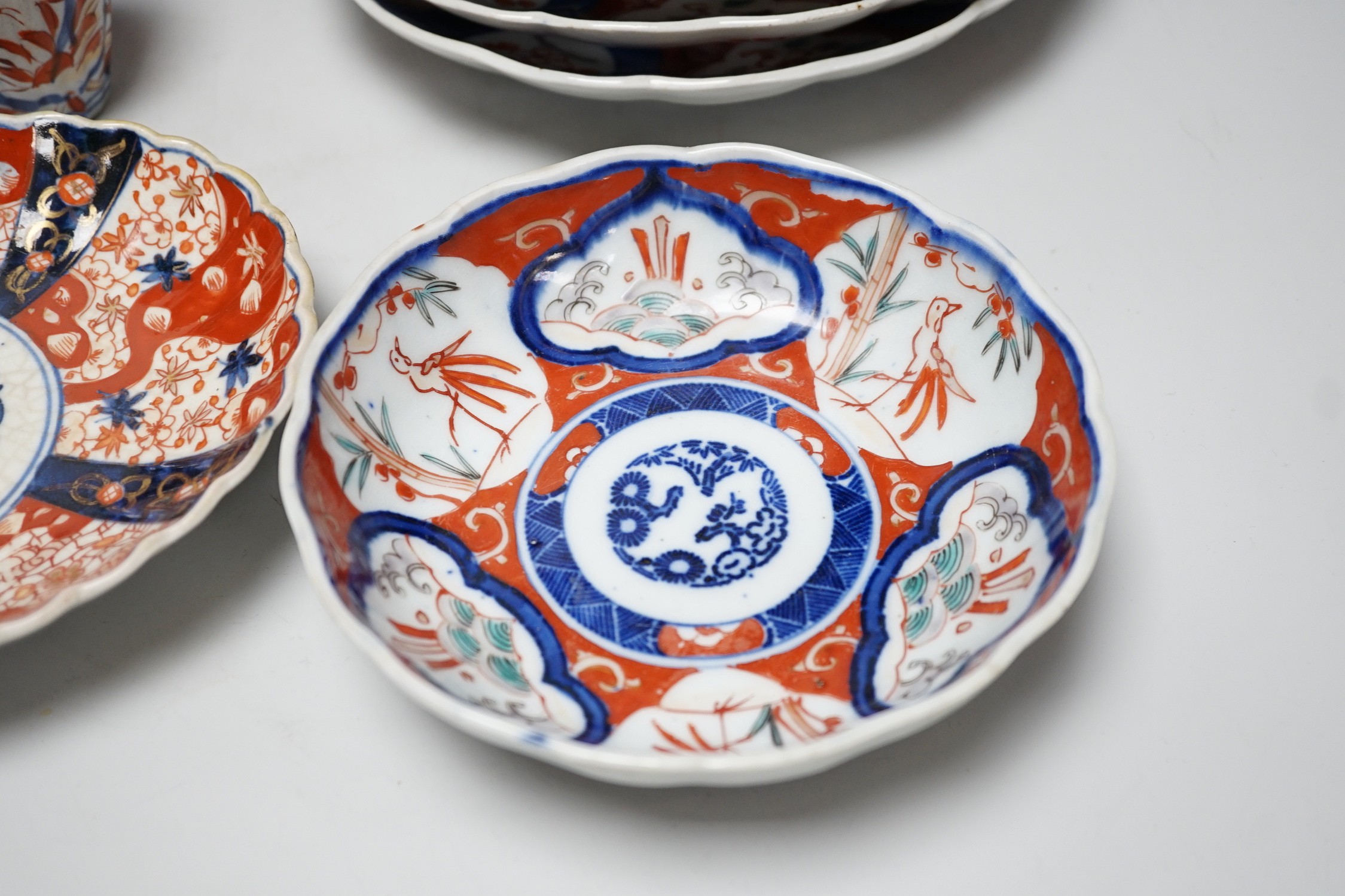 A group of Imari vases and dishes, tallest 19cm